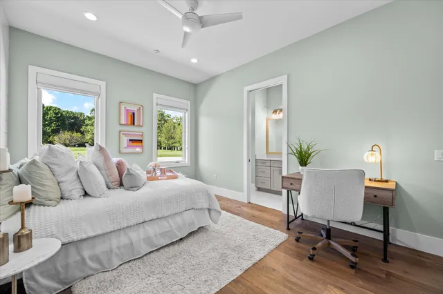 a view of a house with swimming pool and sitting area