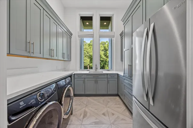 a backyard of a house with yard table and chairs