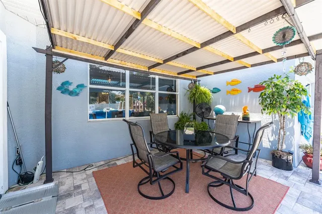 a dining room with furniture and wooden floor