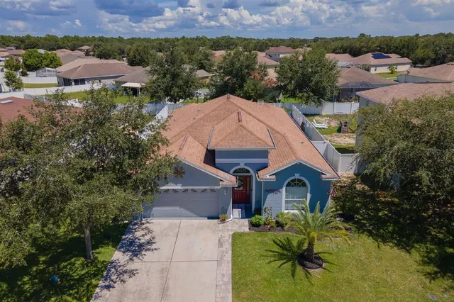 an aerial view of a house with a garden