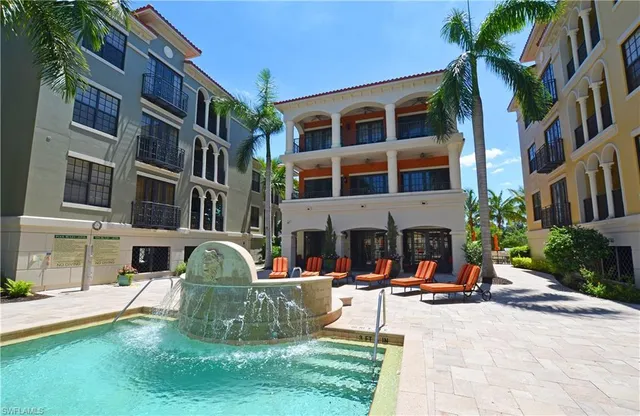 a view of a swimming pool with lounge chair