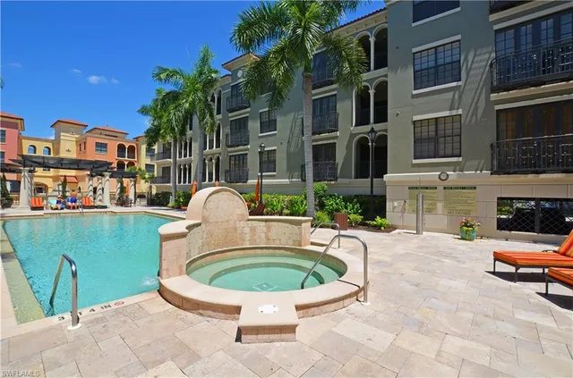 a view of balcony with wooden floor and outdoor seating