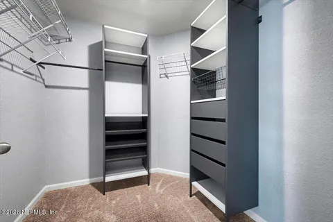 a view of an empty walk in closet
