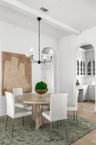 a bathroom with a granite countertop toilet sink and mirror