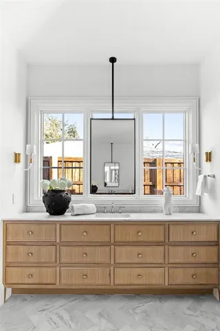 a kitchen with a sink and cabinets