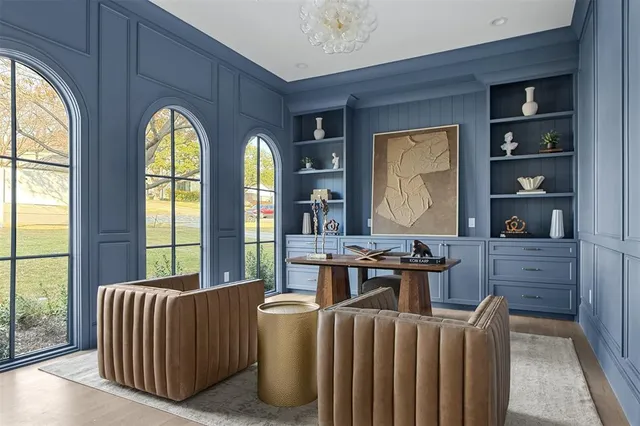 a white bath tub sitting next to a bathroom sink