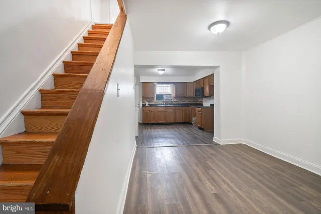 a view of kitchen and wooden floor