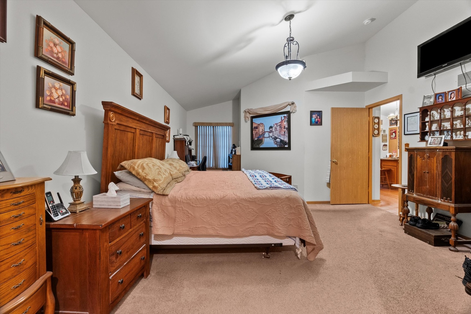 25426 Barrow Road Manhattan, IL 60442 - Photo 14 of 30 a bedroom with a bed and a flat screen tv