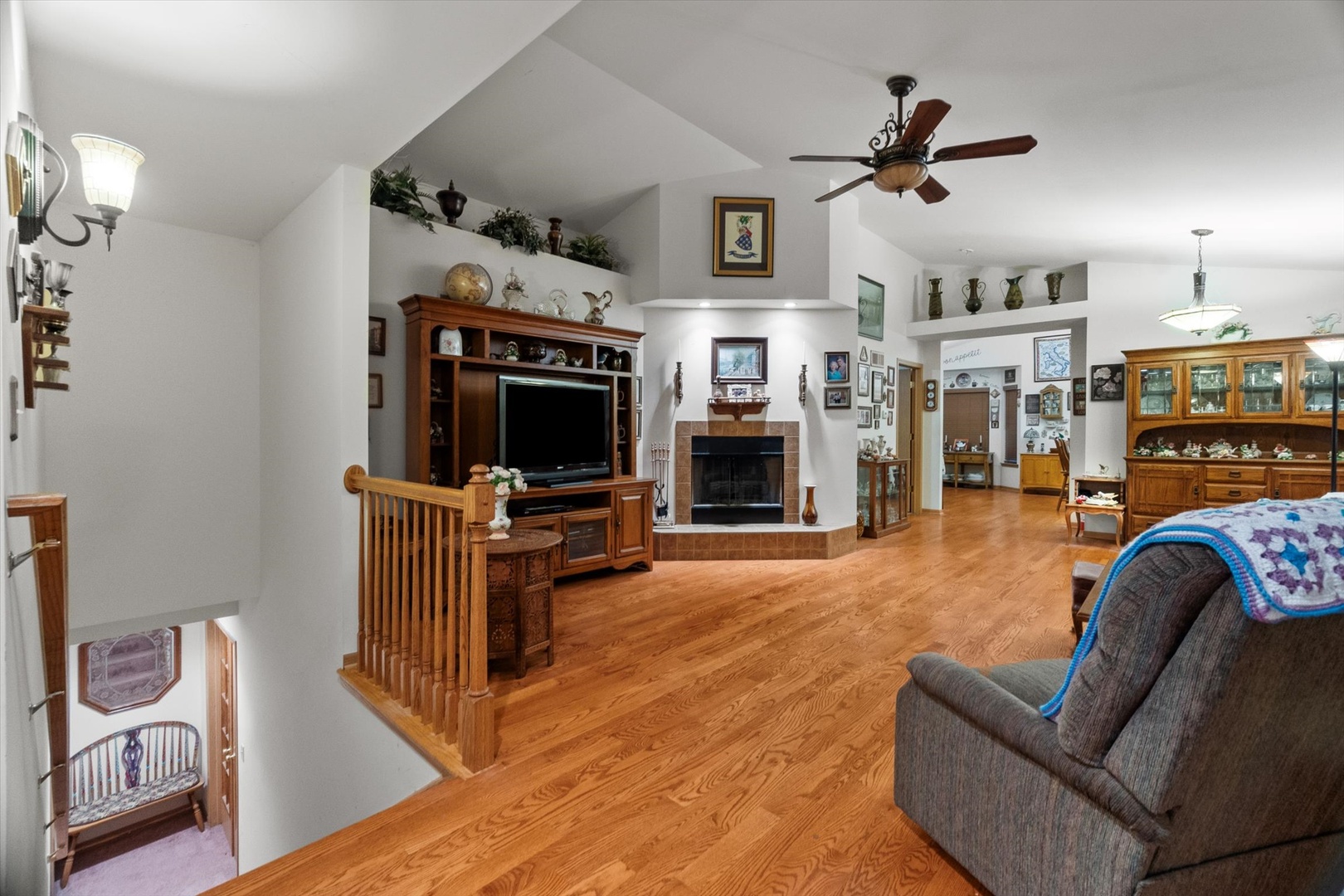25426 Barrow Road Manhattan, IL 60442 - Photo 4 of 30 a living room with furniture a flat screen tv and a fireplace