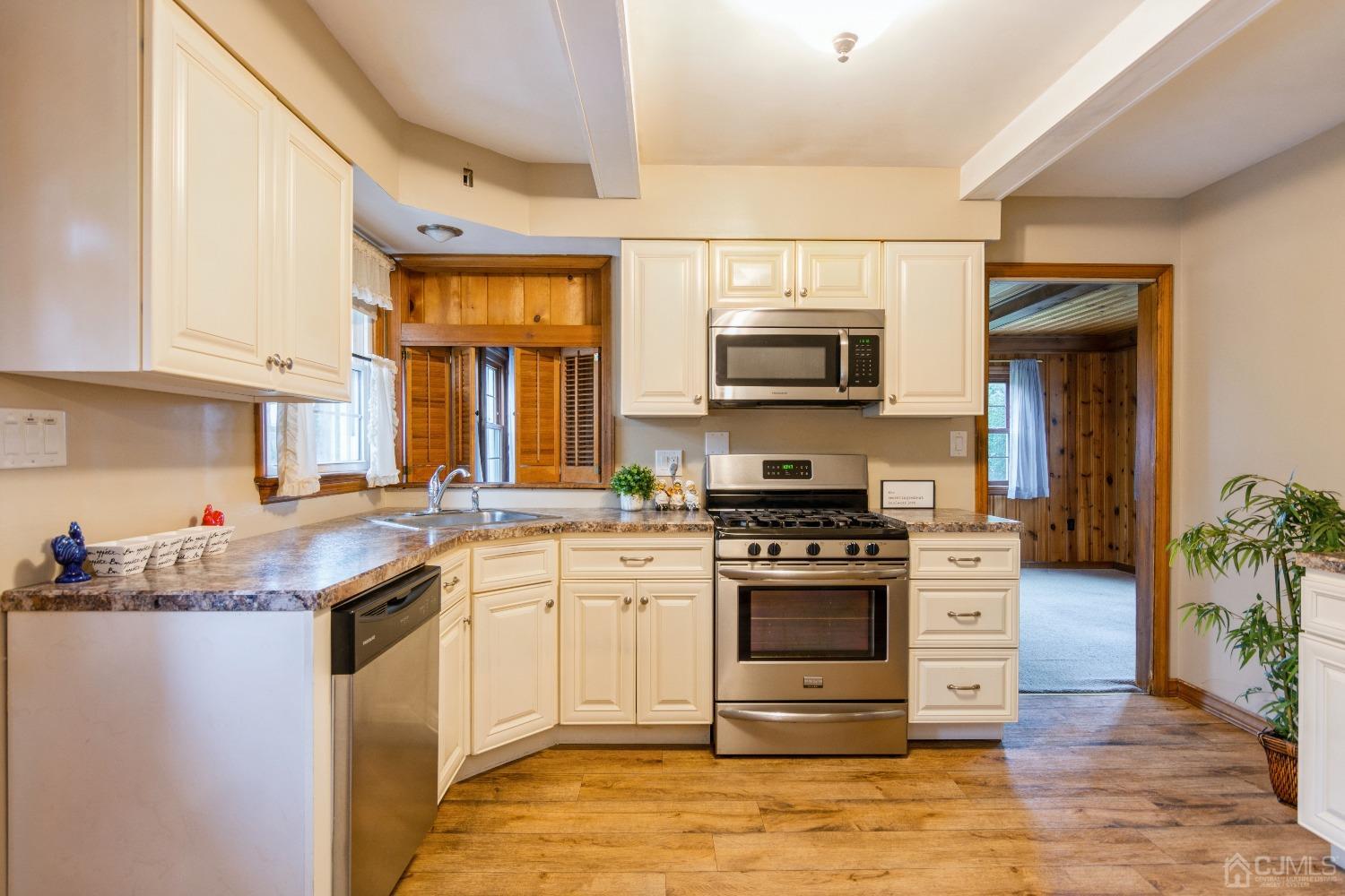 168 Dunhams Corner Road East Brunswick, NJ 08816 - Photo 11 of 30 Kitchen leading into the family room