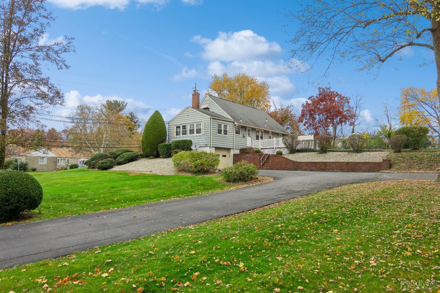 168 Dunhams Corner Road East Brunswick, NJ 08816 - Photo 2 of 30 Gorgeous 0.8 acres of property! Driveway leading to the garage at the back of the house! Can accommodate several cars!
