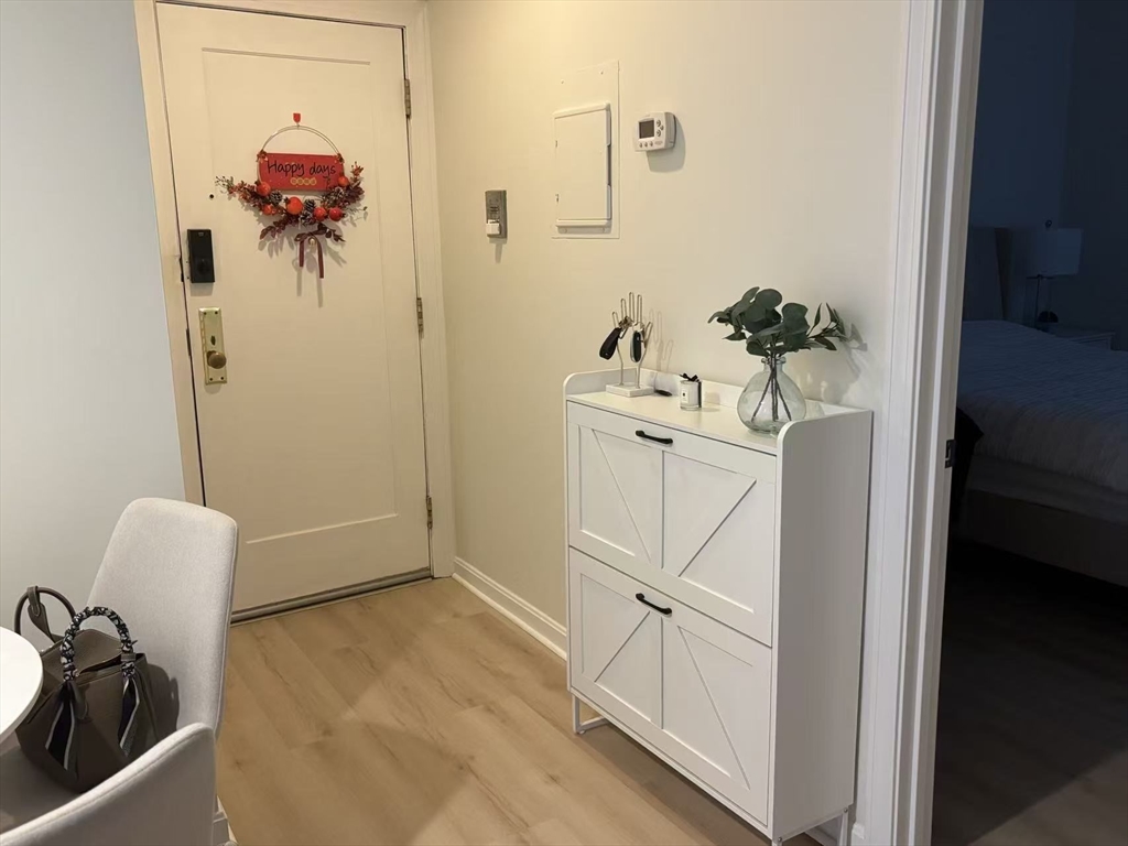1423 Commonwealth Avenue, Unit 202 Boston, MA 02135 - Photo 5 of 6 a view of a hallway with workspace