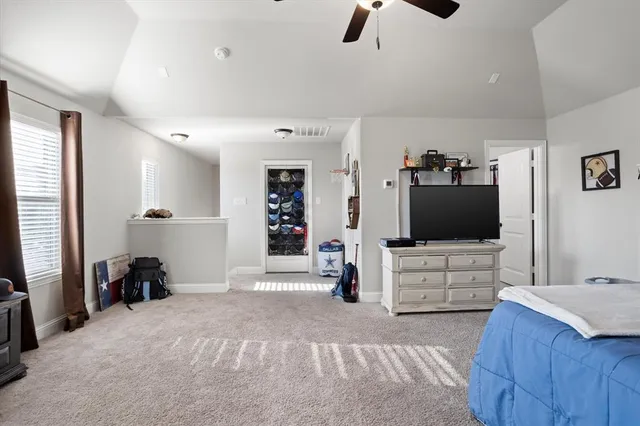 a bedroom with a bed and a couch