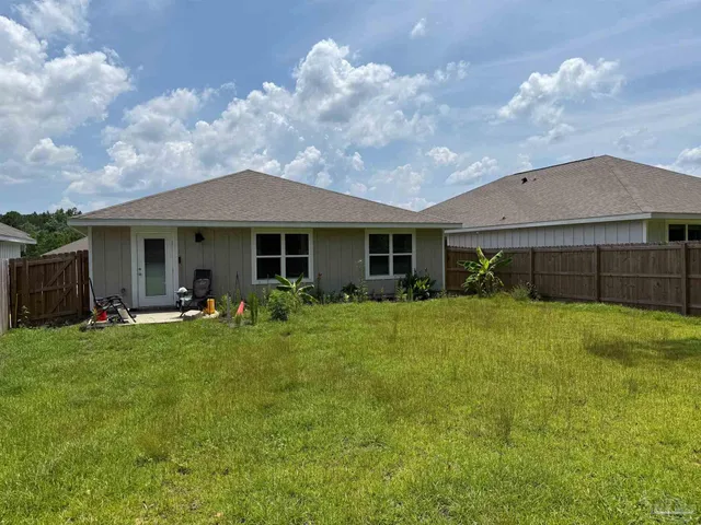 a front view of a house with a garden and porch
