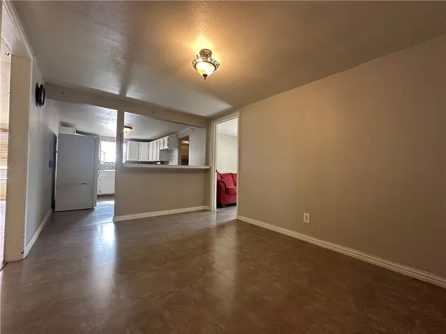 a view of a kitchen with a sink and a window