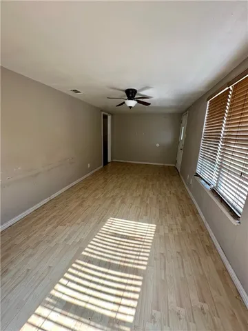 a view of a room with a wooden floor