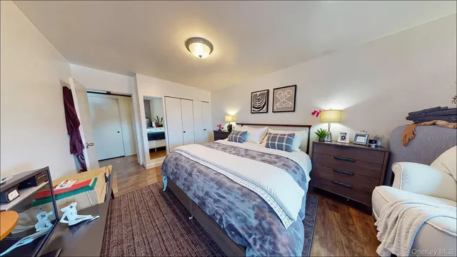 a bedroom with bed and a window