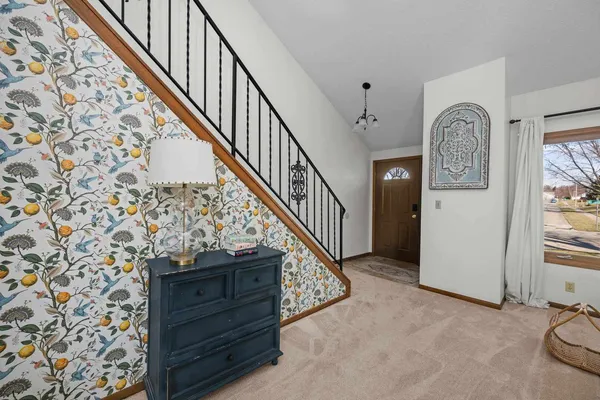 a view of entryway with wooden floor