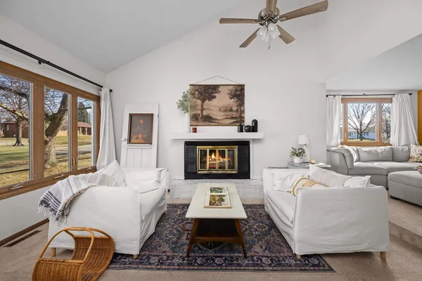 a living room with furniture and a large window