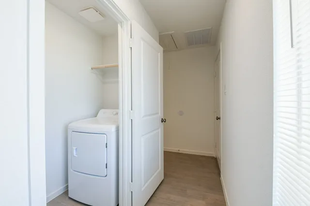 a view of bathroom with washer and dryer
