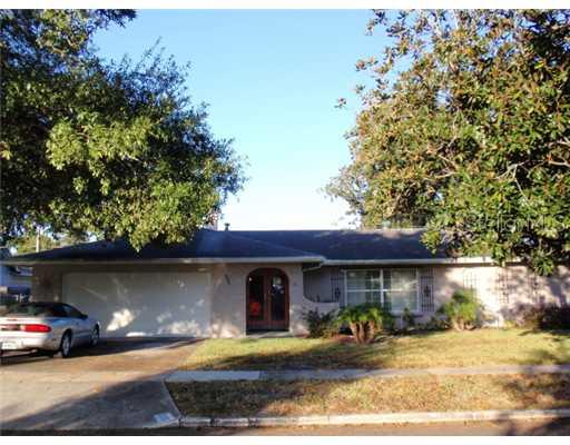 525 Roughbeard Road Winter Park, FL 32792 - Photo 1 of 1 a front view of a house with a yard and garage