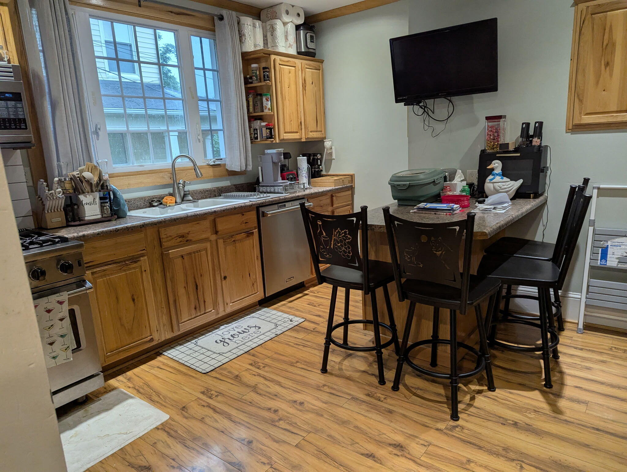1925 Denniston Avenue Southwest Roanoke, VA 24015 - Photo 12 of 19 a kitchen with a dining table chairs and a flat screen tv