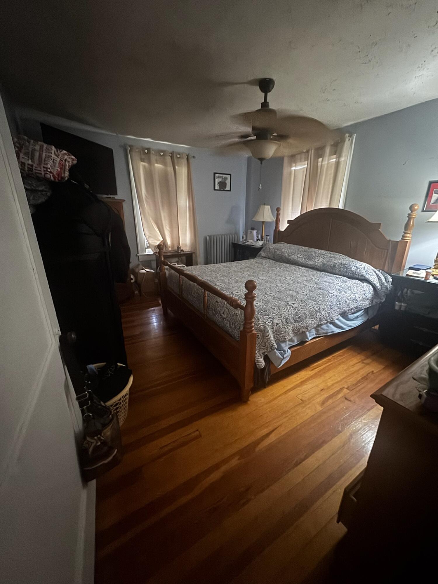 1925 Denniston Avenue Southwest Roanoke, VA 24015 - Photo 16 of 19 a spacious bedroom with a bed and a chandelier