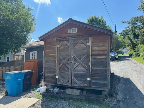 a view of a house with a fence