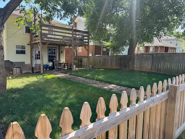 a front view of house with outdoor seating