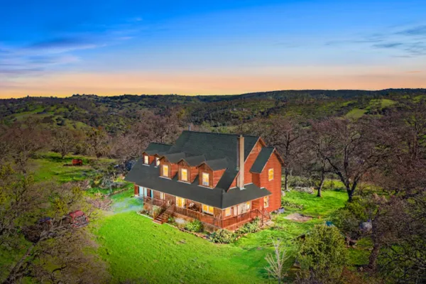 an aerial view of a house with a garden
