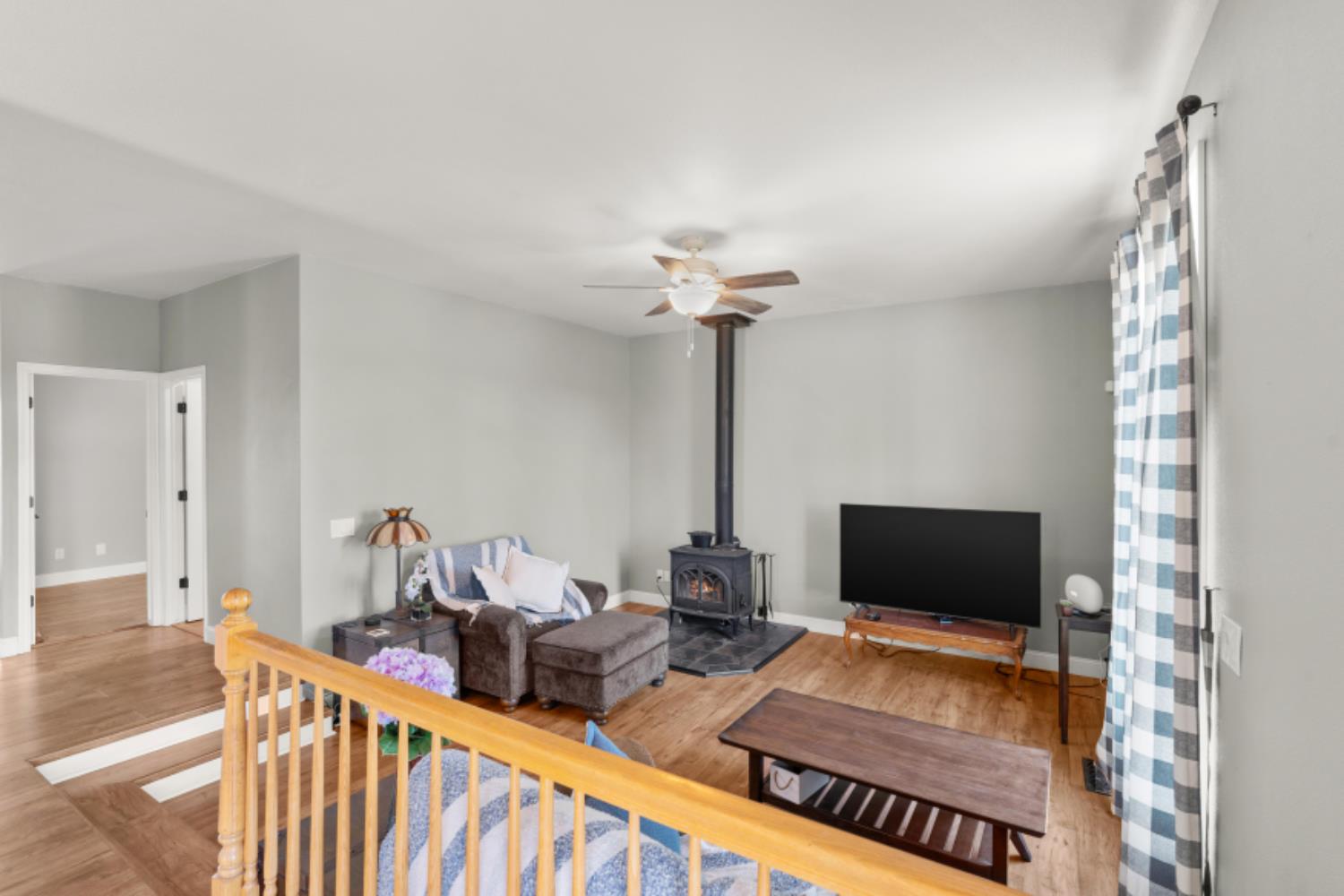 8251 Buffalo Ridge Road Ione, CA 95640 - Photo 16 of 75 a living room with furniture and a flat screen tv
