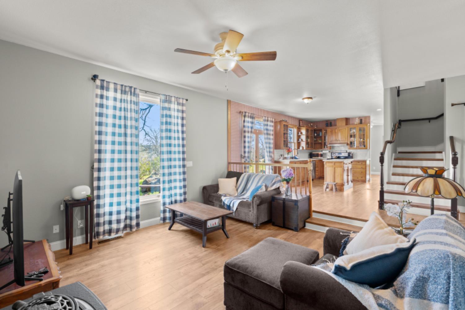 8251 Buffalo Ridge Road Ione, CA 95640 - Photo 18 of 75 a living room with furniture and a flat screen tv