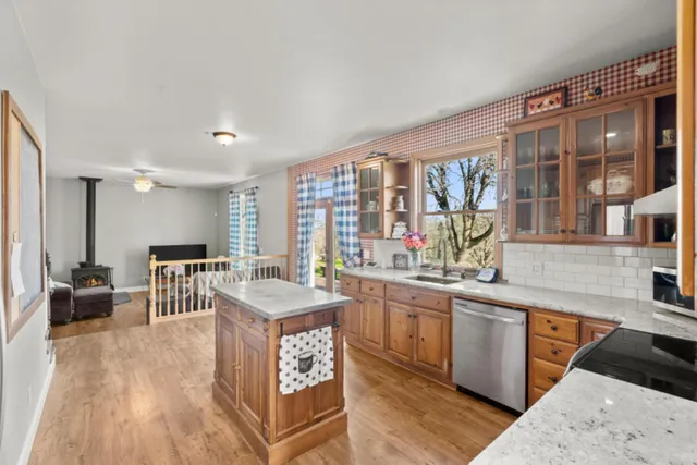 a view of an entryway with wooden floor