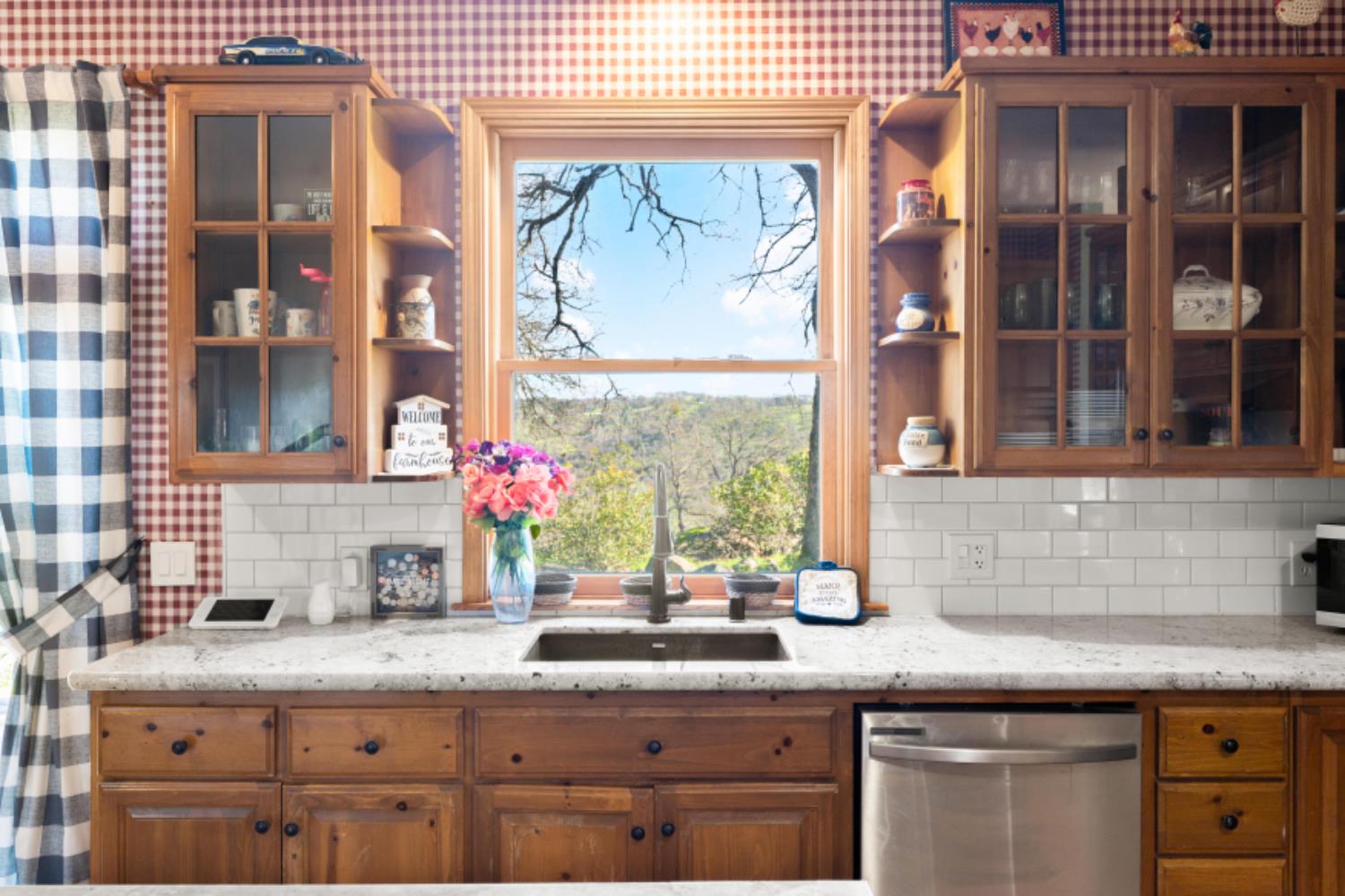 8251 Buffalo Ridge Road Ione, CA 95640 - Photo 24 of 75 a kitchen with granite countertop a sink and cabinets