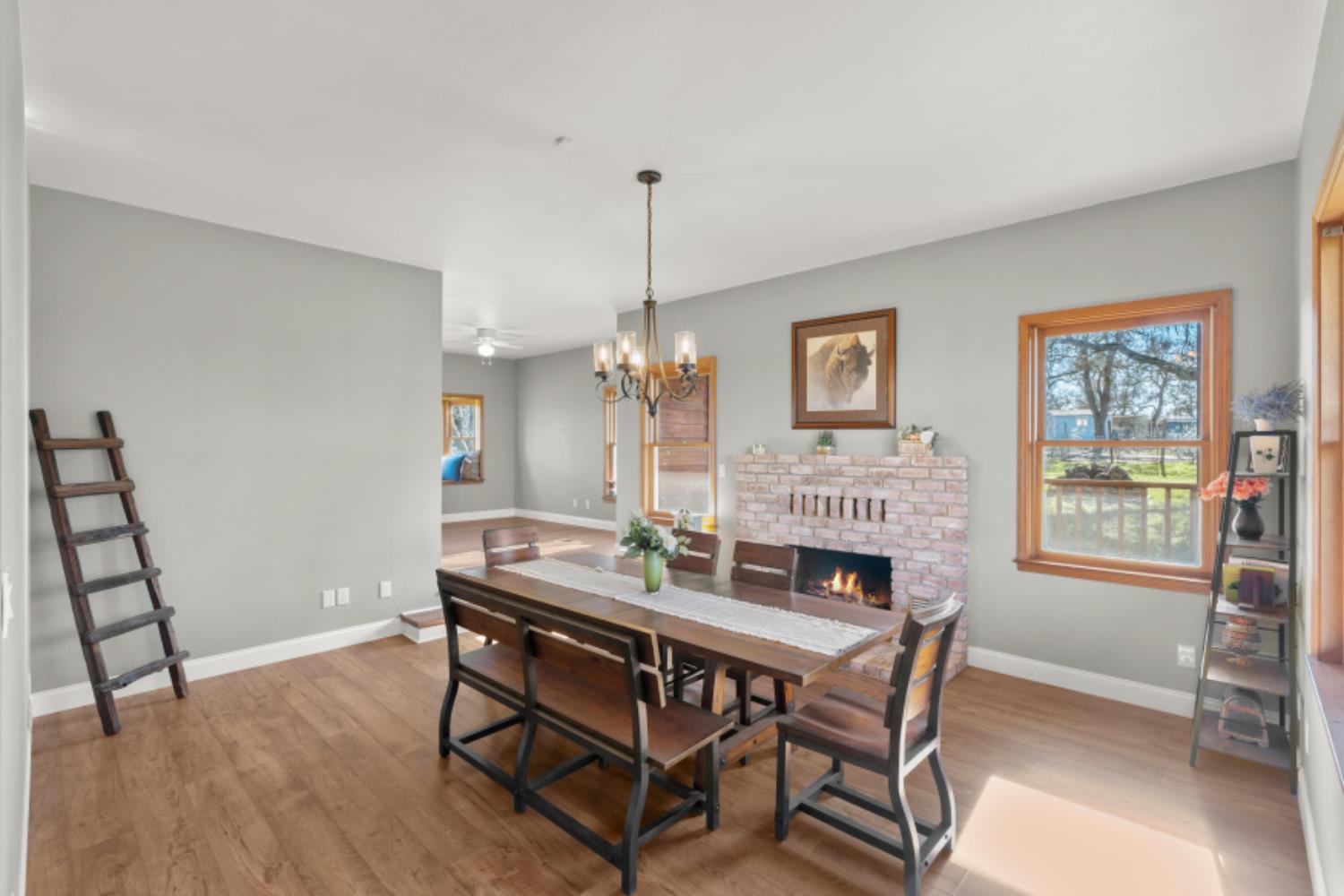8251 Buffalo Ridge Road Ione, CA 95640 - Photo 32 of 75 a view of a dining room with furniture window and wooden floor