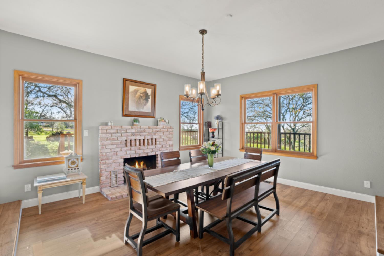 8251 Buffalo Ridge Road Ione, CA 95640 - Photo 33 of 75 a view of a dining room with furniture window and wooden floor