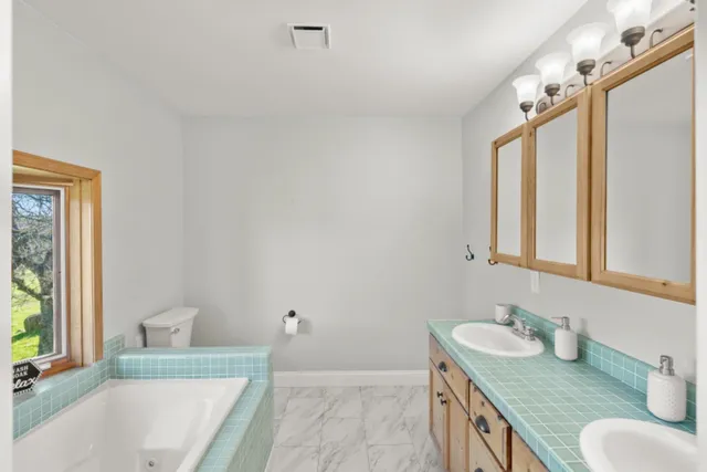 a backyard of a house with lots of green space