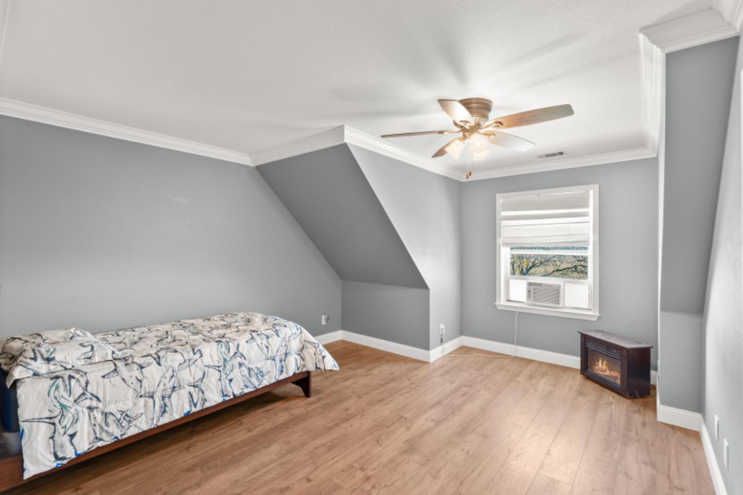 8251 Buffalo Ridge Road Ione, CA 95640 - Photo 48 of 75 a bedroom with a bed and a window