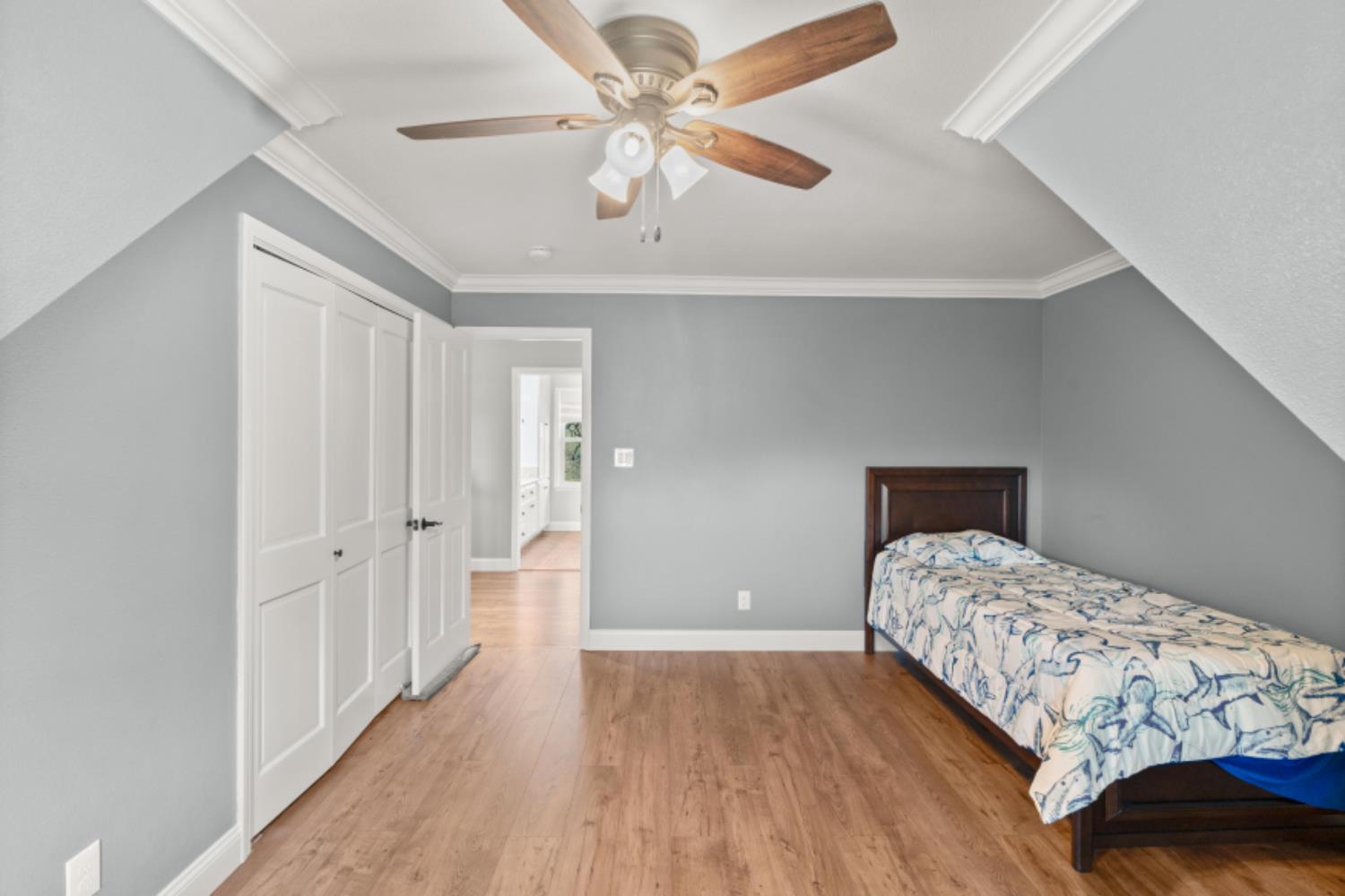 8251 Buffalo Ridge Road Ione, CA 95640 - Photo 49 of 75 a bedroom with a bed and a chandelier