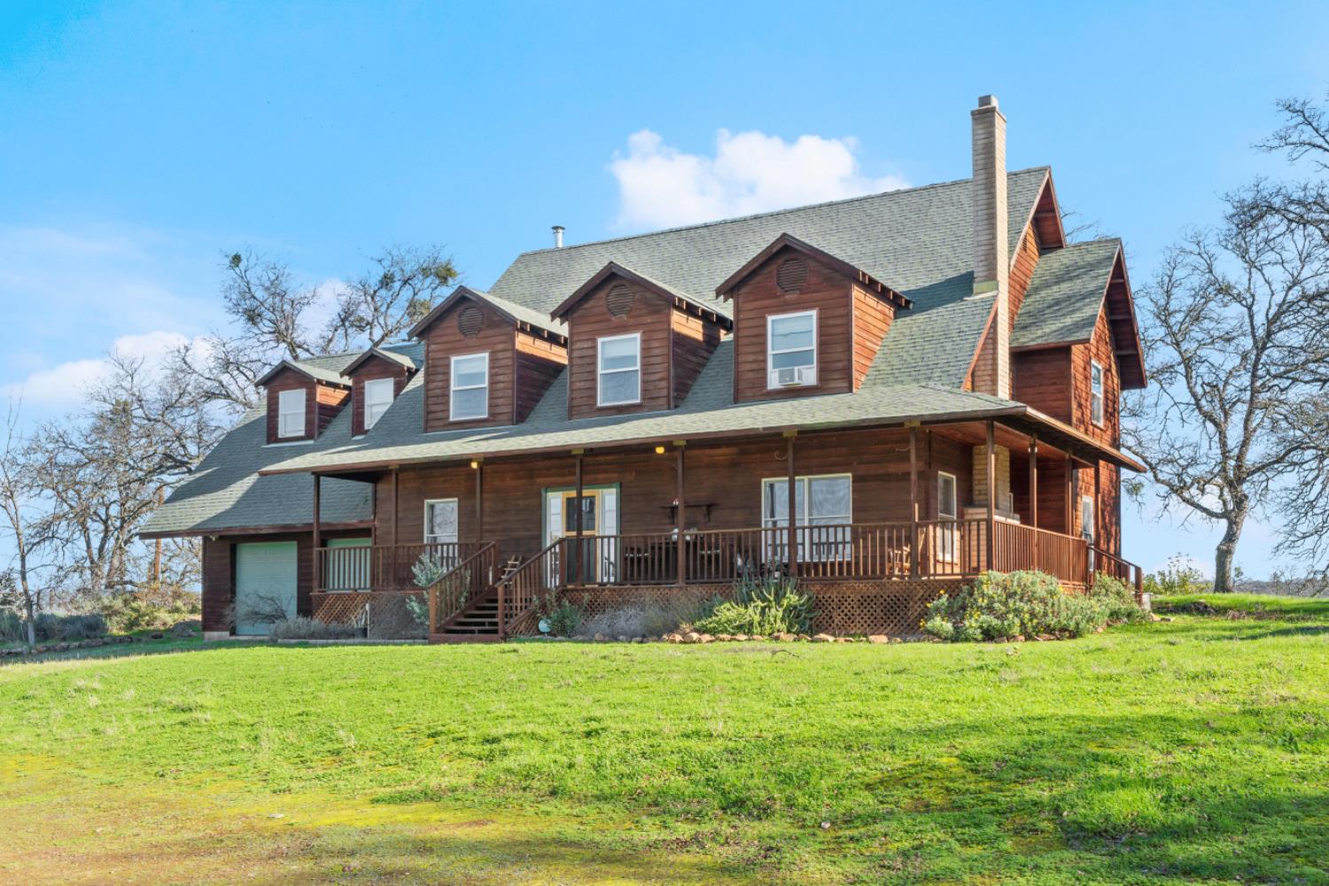 8251 Buffalo Ridge Road Ione, CA 95640 - Photo 9 of 75 a front view of a house with a yard