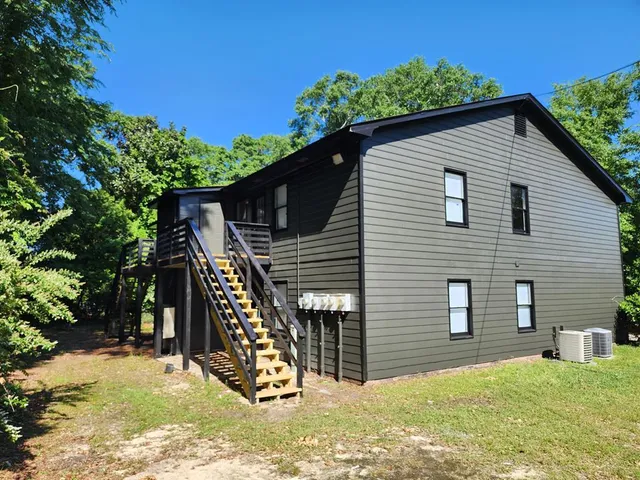 a backyard of a house with seating space