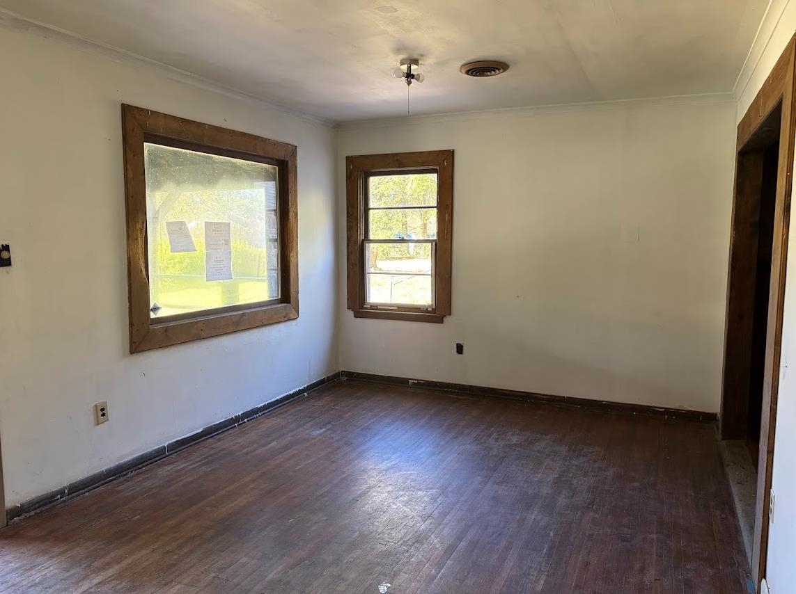 7638 Marvin Road Millington, TN 38053 - Photo 13 of 25 a view of an empty room with wooden floor and a window