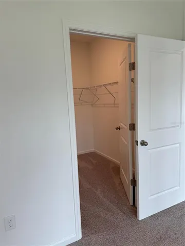 a kitchen with stainless steel appliances a refrigerator sink and microwave