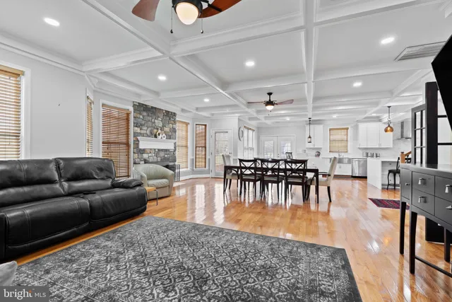 a spacious bathroom with a granite countertop sink a mirror and a vanity