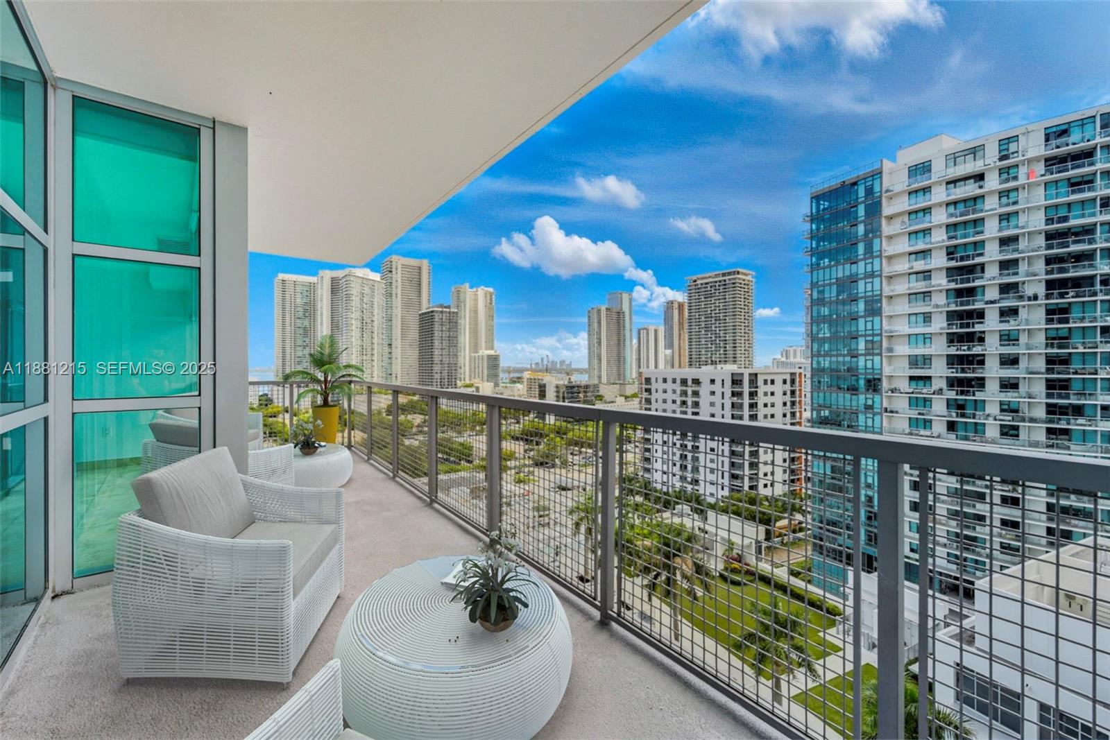 3301 Northeast 1st Avenue, Unit H1510 Miami, FL 33137 - Photo 16 of 23 a balcony with chairs and a table