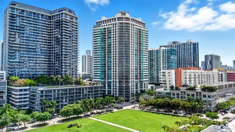 a view of a city with tall buildings