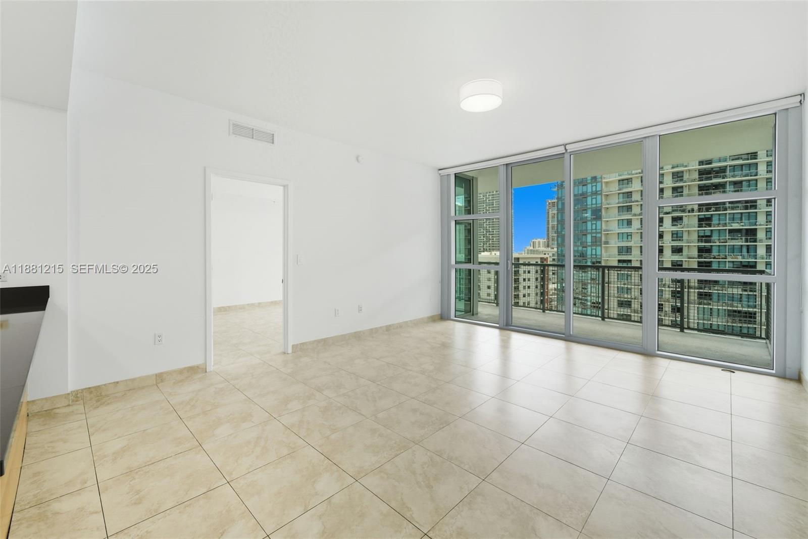 3301 Northeast 1st Avenue, Unit H1510 Miami, FL 33137 - Photo 5 of 23 a view of an empty room with glass door