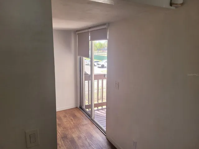 a view of an empty room and window