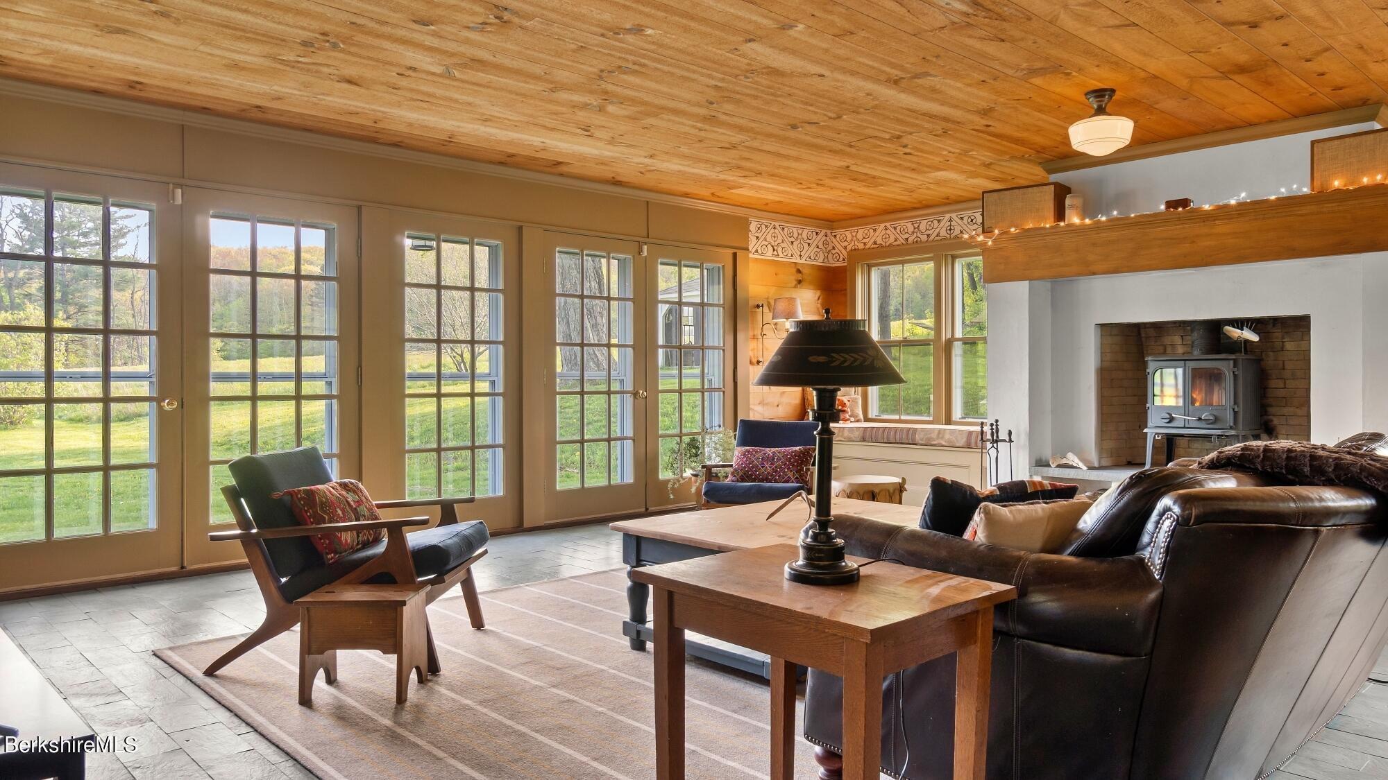2325 Hancock Road Hancock, MA 01267 - Photo 20 of 61 a living room with furniture and floor to ceiling windows