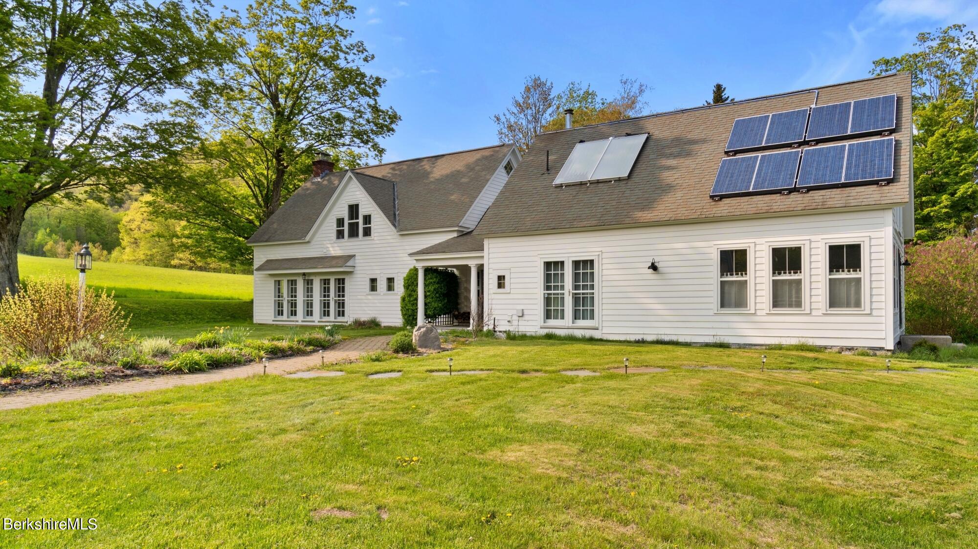 2325 Hancock Road Hancock, MA 01267 - Photo 2 of 61 a front view of a house with a yard